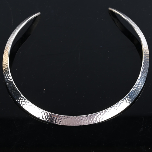 214 - NIELS ERIK FROM - a Danish sterling silver modernist neck torque, hand planished decoration, interna... 