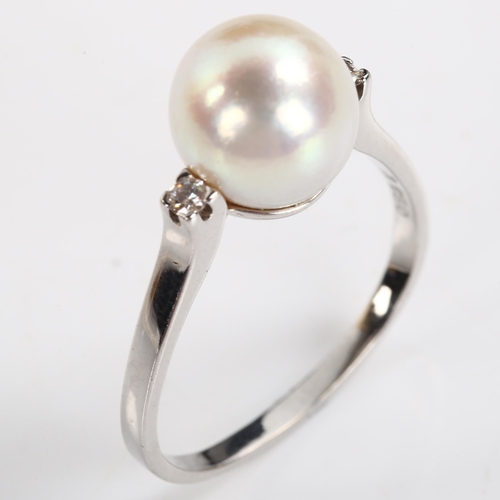 223 - A 1970s 18ct white gold whole pearl and diamond dress ring, set with modern round brilliant-cut diam... 