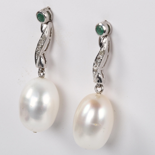 250 - A pair of pearl emerald and diamond drop earrings, unmarked white metal settings, earring height 34m... 