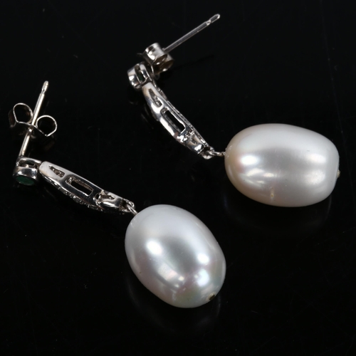 250 - A pair of pearl emerald and diamond drop earrings, unmarked white metal settings, earring height 34m... 