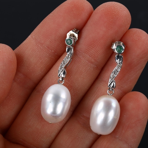 250 - A pair of pearl emerald and diamond drop earrings, unmarked white metal settings, earring height 34m... 