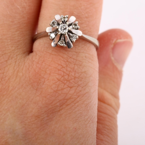 253 - A modern 18ct white gold diamond cluster flowerhead ring, set with modern round brilliant-cut diamon... 