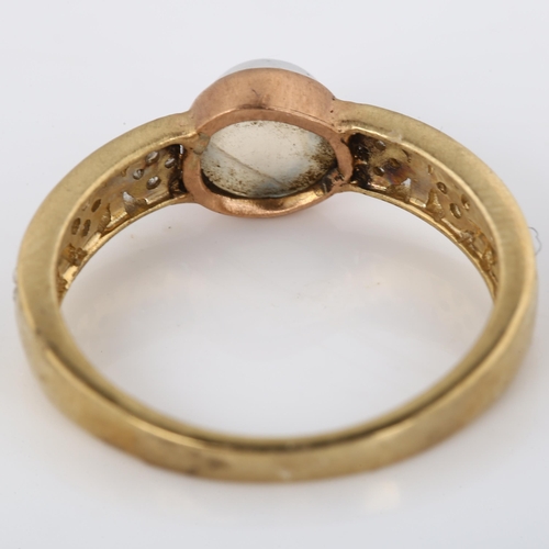 255 - A modern 9ct gold moonstone and diamond dress ring, set with round high cabochon moonstone and singl... 