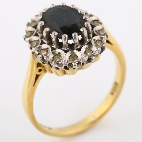 265 - A late 20th century 18ct gold sapphire and diamond cluster ring, set with oval mixed-cut sapphire an... 