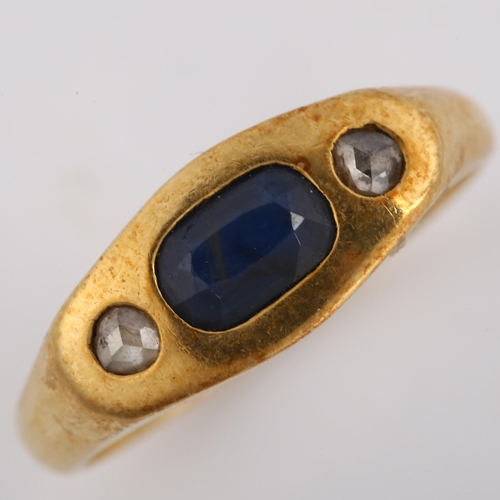 268 - A heavy three stone sapphire and diamond ring, unmarked gold settings with oval mixed-cut sapphire a... 