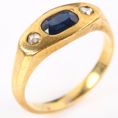 268 - A heavy three stone sapphire and diamond ring, unmarked gold settings with oval mixed-cut sapphire a... 