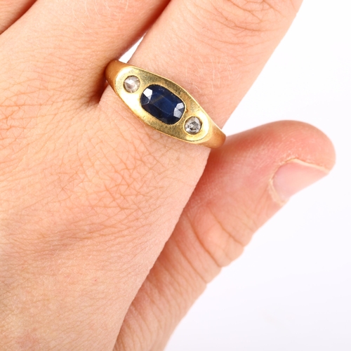 268 - A heavy three stone sapphire and diamond ring, unmarked gold settings with oval mixed-cut sapphire a... 