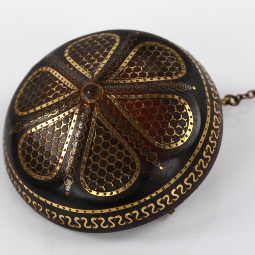 270 - A Victorian tortoiseshell gold and silver pique inlaid bombe shield brooch, diameter 40.9mm, 10g