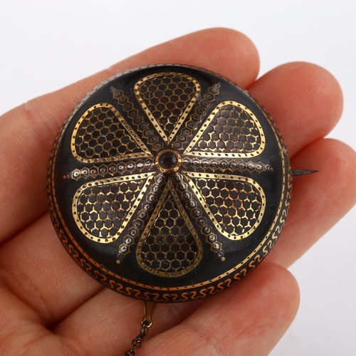 270 - A Victorian tortoiseshell gold and silver pique inlaid bombe shield brooch, diameter 40.9mm, 10g