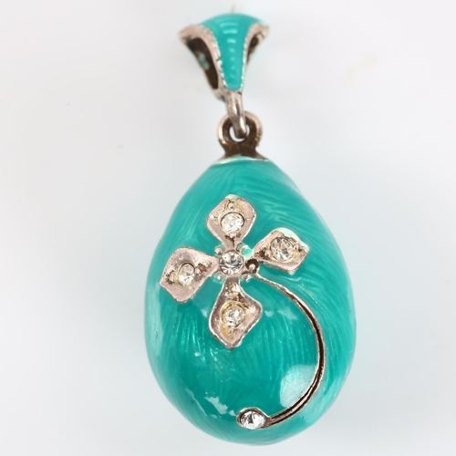 273 - A miniature Continental sterling silver turquoise enamel and cubic zirconia egg pendant, with flower... 