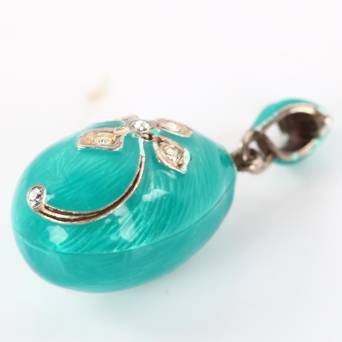 273 - A miniature Continental sterling silver turquoise enamel and cubic zirconia egg pendant, with flower... 