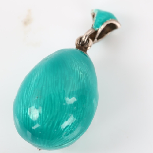 273 - A miniature Continental sterling silver turquoise enamel and cubic zirconia egg pendant, with flower... 