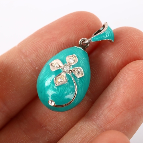 273 - A miniature Continental sterling silver turquoise enamel and cubic zirconia egg pendant, with flower... 