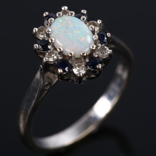 276 - A late 20th century 18ct white gold opal sapphire and diamond cluster ring, set with oval cabochon o... 