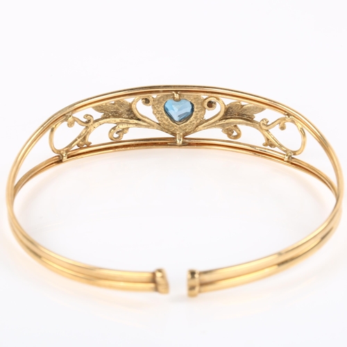 286 - A modern 9ct rose gold blue topaz heart torque bracelet, openwork floral design, setting height 13.9... 