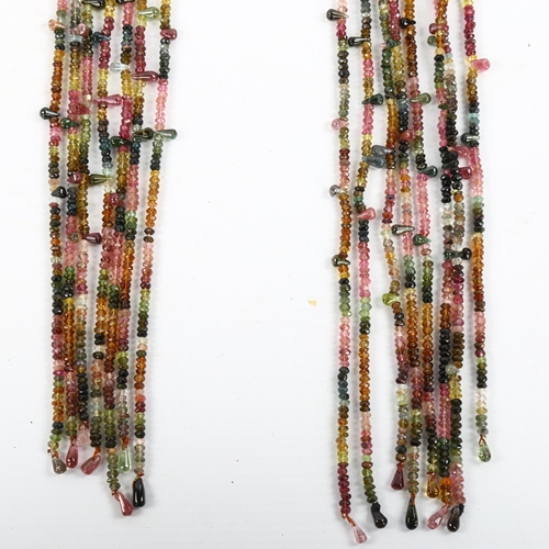 289 - A Vintage 8-strand vari-hue tourmaline scarf drape necklace, with rough-cut and teardrop beads, over... 