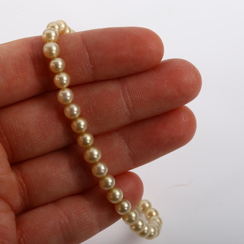 293 - A single-strand graduated pearl necklace, with 9ct rose gold barrel clasp, pearls ranging from 3.2mm... 