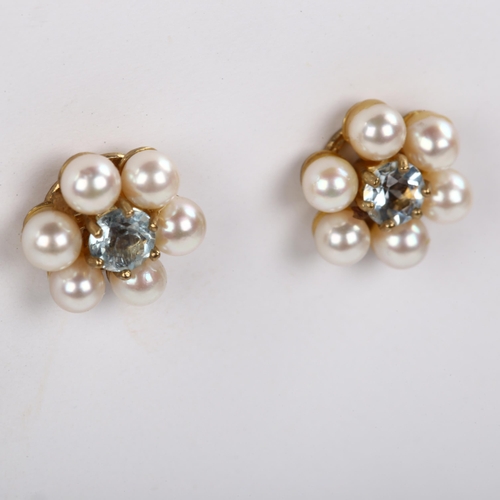 296 - A pair of late 20th century 9ct gold aquamarine and pearl cluster earrings, with stud fittings, hall... 