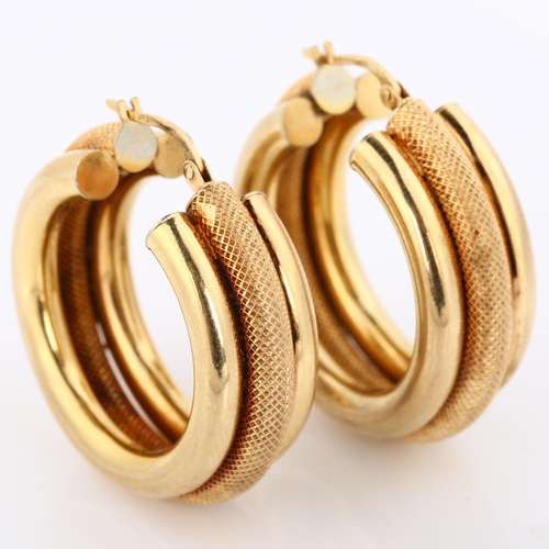 300 - A pair of 9ct gold hollow hoop earrings, textured and polished design, diameter 31.6mm, 9g