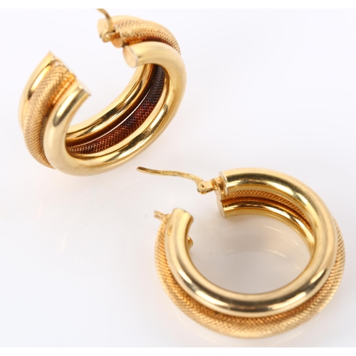 300 - A pair of 9ct gold hollow hoop earrings, textured and polished design, diameter 31.6mm, 9g