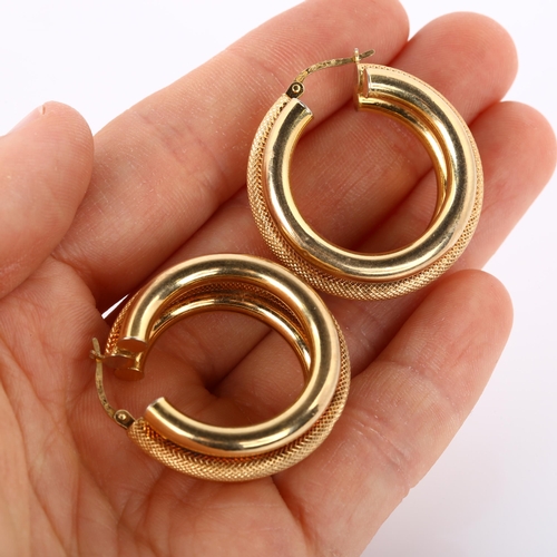 300 - A pair of 9ct gold hollow hoop earrings, textured and polished design, diameter 31.6mm, 9g