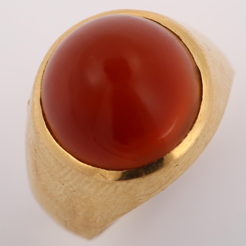 308 - A Continental carnelian dress ring, gold settings with round high cabochon carnelian, setting height... 