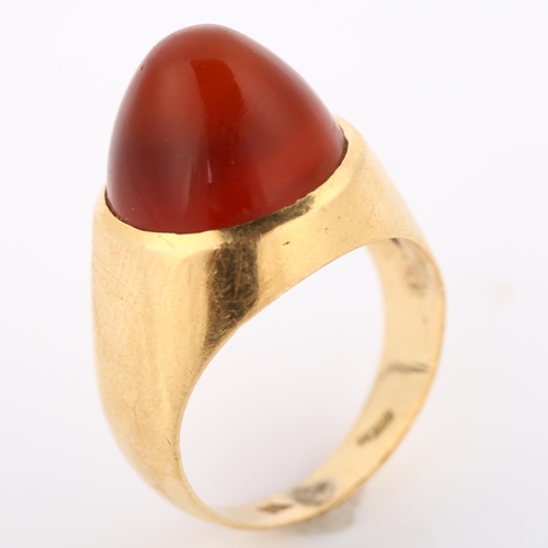 308 - A Continental carnelian dress ring, gold settings with round high cabochon carnelian, setting height... 