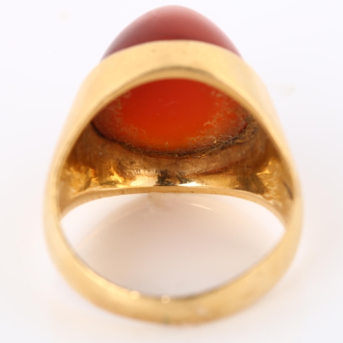 308 - A Continental carnelian dress ring, gold settings with round high cabochon carnelian, setting height... 