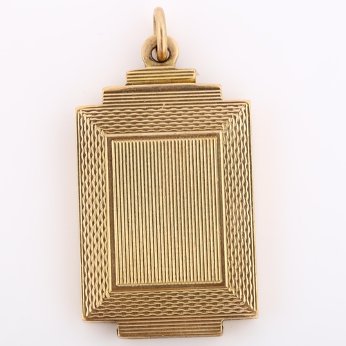 309 - An Art Deco 9ct gold photo locket pendant, stepped rectangular form with engine turned decoration an... 