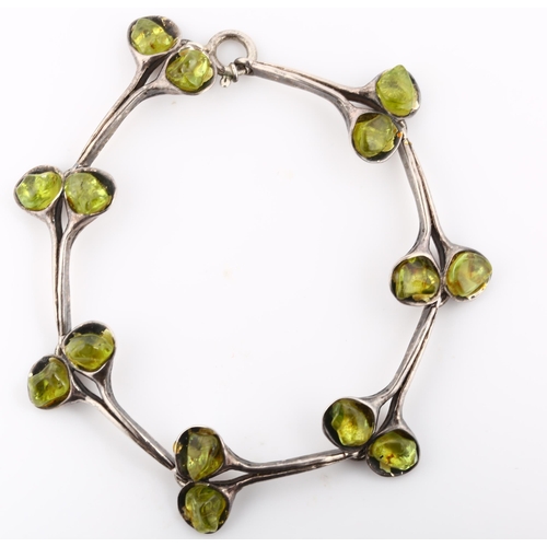 310 - A Vintage Continental silver peridot flower bud bracelet, length 18.5cm, 21.5g