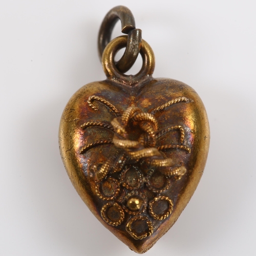 338 - A miniature Victorian 15ct gold heart pendant, with applied knot motif and relief embossed foliate d... 