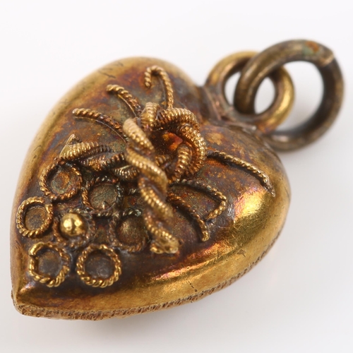 338 - A miniature Victorian 15ct gold heart pendant, with applied knot motif and relief embossed foliate d... 