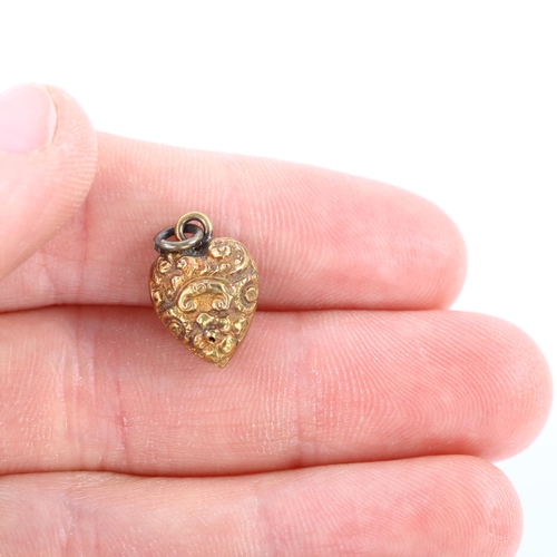 338 - A miniature Victorian 15ct gold heart pendant, with applied knot motif and relief embossed foliate d... 