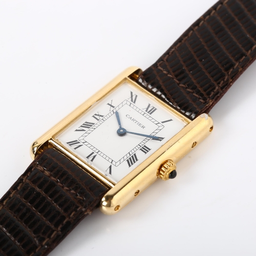 14 - CARTIER - a mid-size 18ct gold Tank quartz wristwatch, white enamel dial with Roman numeral hour mar... 