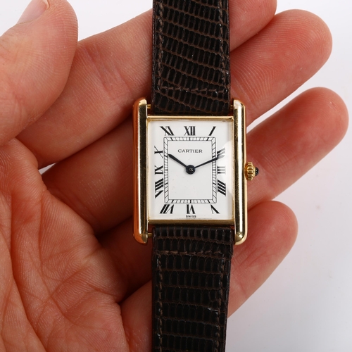 14 - CARTIER - a mid-size 18ct gold Tank quartz wristwatch, white enamel dial with Roman numeral hour mar... 