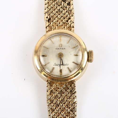 20 - OMEGA - a lady's 9ct gold Ladymatic automatic bracelet watch, circa 1966, silvered dial with gilt ba... 