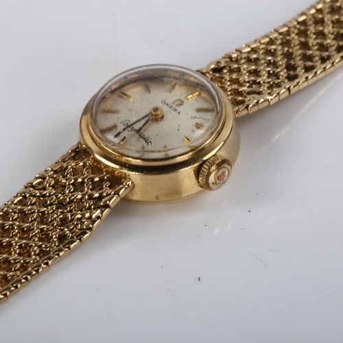 20 - OMEGA - a lady's 9ct gold Ladymatic automatic bracelet watch, circa 1966, silvered dial with gilt ba... 