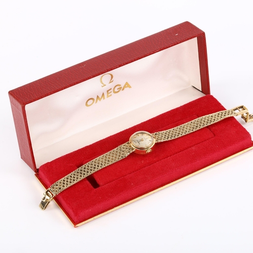 20 - OMEGA - a lady's 9ct gold Ladymatic automatic bracelet watch, circa 1966, silvered dial with gilt ba... 