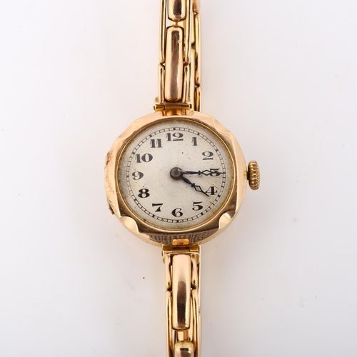 24 - A lady's 9ct gold mechanical bracelet watch, silvered dial with Arabic numerals, blued steel hands a... 