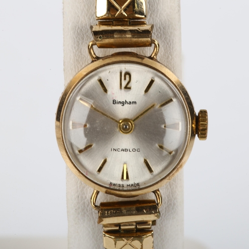 25 - BINGHAM - a lady's 9ct gold mechanical bracelet watch, silvered dial with gilt arrowhead hour marker... 