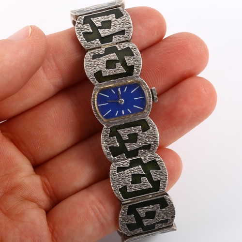 28 - A lady's mid-century silver and enamel bracelet watch, blue enamel dial with white baton hour marker... 