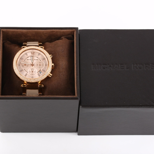 30 - MICHAEL KORS - a lady's rose gold plated stainless steel quartz chronograph bracelet watch, ref. MK-... 