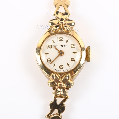 32 - W HINDS - a lady's 9ct gold mechanical bracelet watch, silvered dial with gilt eighthly Arabic numer... 