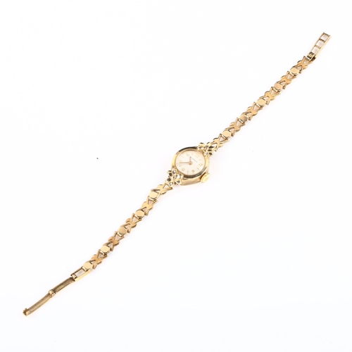 32 - W HINDS - a lady's 9ct gold mechanical bracelet watch, silvered dial with gilt eighthly Arabic numer... 