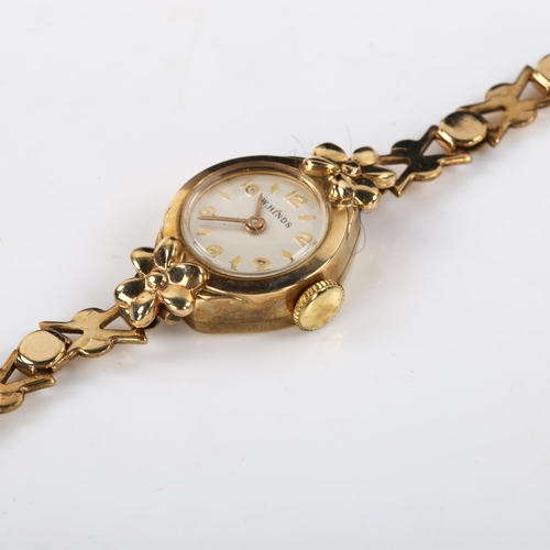 32 - W HINDS - a lady's 9ct gold mechanical bracelet watch, silvered dial with gilt eighthly Arabic numer... 