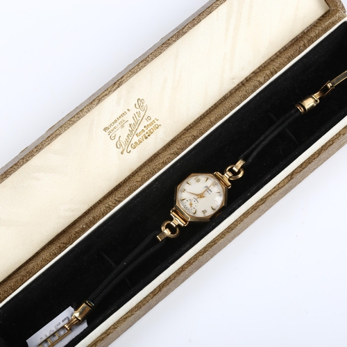 33 - MONDIA - a lady's 9ct gold mechanical wristwatch, textured silvered dial with gilt eighthly Arabic n... 