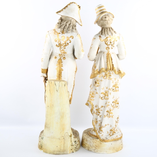 1033 - A large pair of 19th century Continental porcelain figures, in painted and gilded dress, factory mar... 