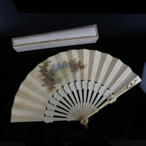 1056 - A 19th century French bone fan, with hand painted paper screen depicting musicians by a fountain, wi... 
