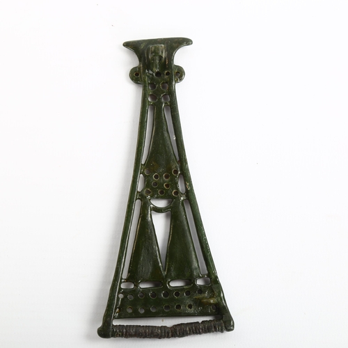 1058 - An Iron Age, Bronze Celtic openwork brooch, with red enamel panels, length 13.5cm