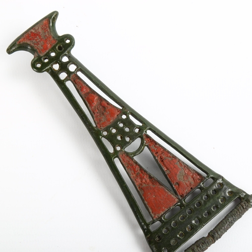 1058 - An Iron Age, Bronze Celtic openwork brooch, with red enamel panels, length 13.5cm